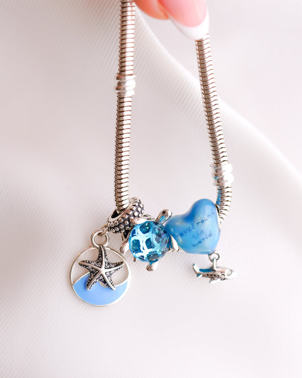 COMBO CORAZON VIAJERO (CHARMS + BRAZALETE 16CM)